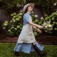 joyful-woman-gardening-in-springtime after discovering a variety of creative ways to use mulch