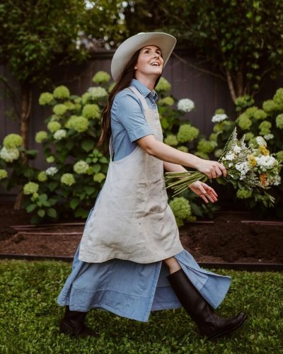 joyful-woman-gardening-in-springtime after discovering a variety of creative ways to use mulch
