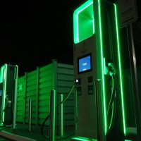 wood chipping innovations for biofuel production illustrated by green fuel pumps