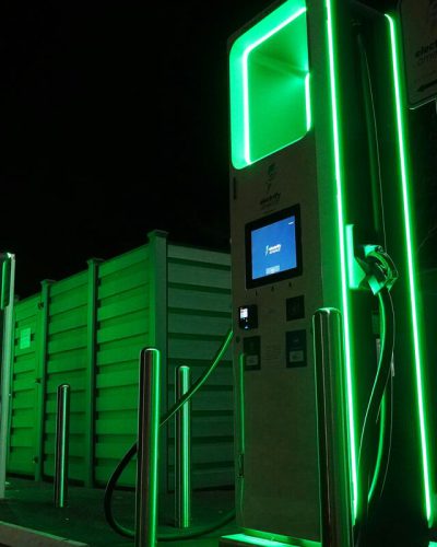 wood chipping innovations for biofuel production illustrated by green fuel pumps