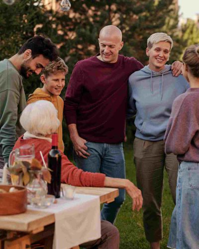 Family enjoying a relaxed Mother’s Day appreciation moment together outdoors with simple shared time
